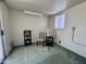 Room with a window, an accent chair, small table and shelving. Sliding door on the left at 120 N Val Vista Dr # 272, Mesa, AZ 85213