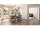 Dining room featuring modern table, bench and chairs set, stylish light fixture and decorative shelving at 1225 S 160Th Ln, Goodyear, AZ 85338