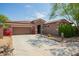 Charming single story home featuring low maintenance desert landscaping and attached two car garage at 1225 S 160Th Ln, Goodyear, AZ 85338