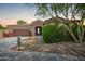 Charming single story home featuring low maintenance desert landscaping and attached two car garage at 1225 S 160Th Ln, Goodyear, AZ 85338