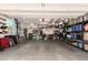 Spacious three-car garage offering ample storage with shelving and an open layout at 1225 S 160Th Ln, Goodyear, AZ 85338
