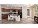 Kitchen with large island, breakfast bar seating, tile backsplash and stainless steel appliances at 1225 S 160Th Ln, Goodyear, AZ 85338