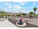 Relaxing balcony with views of desert landscape, golf course, and mountains, complemented by a table and chairs at 1228 E Mountain Vista Dr, Phoenix, AZ 85048