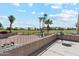 Balcony view overlooking a golf course, desert landscaping, and mountain scenery, with table and chairs at 1228 E Mountain Vista Dr, Phoenix, AZ 85048