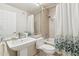 Bathroom featuring a stylish sink, mirror, shower/tub combo with botanical shower curtain at 1228 E Mountain Vista Dr, Phoenix, AZ 85048