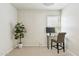 Spare bedroom featuring a desk, chair, and a plant near a window with blinds at 1228 E Mountain Vista Dr, Phoenix, AZ 85048