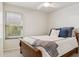 Bedroom featuring a bed with blue decorative pillows and window with blinds at 1228 E Mountain Vista Dr, Phoenix, AZ 85048