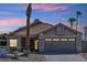 Charming single-story home featuring a tile roof, desert landscaping, and a spacious two-car garage at 1228 E Mountain Vista Dr, Phoenix, AZ 85048