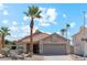 Charming single-story home featuring a tile roof, desert landscaping, and a spacious two-car garage at 1228 E Mountain Vista Dr, Phoenix, AZ 85048