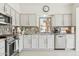 Kitchen with white cabinets, stainless steel appliances, and granite counters at 1228 E Mountain Vista Dr, Phoenix, AZ 85048