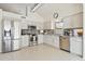Modern kitchen featuring stainless steel appliances, granite countertops, and white cabinetry at 1228 E Mountain Vista Dr, Phoenix, AZ 85048