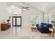 Bright and airy living room with high ceilings, plantation shutters, and tile flooring at 1228 E Mountain Vista Dr, Phoenix, AZ 85048