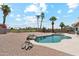 Inviting backyard showcasing a sparkling pool, desert landscaping, and a spacious area for outdoor entertaining at 1228 E Mountain Vista Dr, Phoenix, AZ 85048