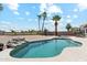 Relaxing backyard featuring a pristine pool, desert landscaping, and an outdoor dining area under a stylish umbrella at 1228 E Mountain Vista Dr, Phoenix, AZ 85048