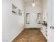 Bright entryway with wood-look tile flooring, white walls, and a console table with decorative accents at 12374 W Hopi St, Avondale, AZ 85323