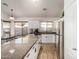 Modern kitchen with granite counters, stainless steel appliances, and natural light at 12374 W Hopi St, Avondale, AZ 85323