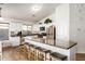 Spacious kitchen featuring a large island with granite countertops and seating at 12374 W Hopi St, Avondale, AZ 85323
