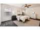 Cozy bedroom with neutral colors, a ceiling fan, and natural light at 128 E Bluejay Dr, Chandler, AZ 85286