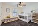 Bedroom featuring bunk beds, a ceiling fan, and organized storage solutions at 128 E Bluejay Dr, Chandler, AZ 85286