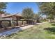 Well-manicured community green space with walking path, trees, and shrubs at 128 E Bluejay Dr, Chandler, AZ 85286