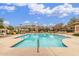 Community swimming pool with lounge chairs and shaded pergola for relaxing at 128 E Bluejay Dr, Chandler, AZ 85286