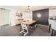 Bright dining area featuring stylish decor, a wooden table, and modern lighting at 128 E Bluejay Dr, Chandler, AZ 85286