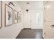Inviting entryway featuring dark wood-look flooring, crisp white walls, and modern lighting fixtures at 128 E Bluejay Dr, Chandler, AZ 85286