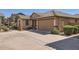 Charming single-story home with lush landscaping and concrete driveway at 128 E Bluejay Dr, Chandler, AZ 85286