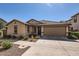 Charming single-story home with a well-maintained lawn and a two-car garage at 128 E Bluejay Dr, Chandler, AZ 85286