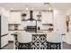 Bright kitchen featuring white cabinets, granite countertops, an island, and decorative pendant lights at 128 E Bluejay Dr, Chandler, AZ 85286