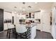 Bright kitchen featuring white cabinets, stainless steel appliances, and a granite island at 128 E Bluejay Dr, Chandler, AZ 85286