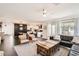 Spacious living room with open floor plan to kitchen and modern decor throughout at 128 E Bluejay Dr, Chandler, AZ 85286
