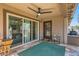 Covered patio with ceiling fan and views of the backyard and additional seating at 128 E Bluejay Dr, Chandler, AZ 85286