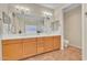 Primary bathroom with double sinks, spacious mirror, and tiled floors at 13450 E Via Linda -- # 2022, Scottsdale, AZ 85259