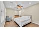 Bedroom features wood floors, a ceiling fan, plantation shutters, and a wet bar at 13450 E Via Linda -- # 2022, Scottsdale, AZ 85259