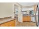 Well-equipped kitchen features wood cabinets, granite countertops, and stainless steel appliances at 13450 E Via Linda -- # 2022, Scottsdale, AZ 85259