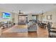 Spacious living and dining area featuring hardwood floors and comfortable seating with lots of natural light at 13450 E Via Linda -- # 2022, Scottsdale, AZ 85259