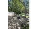 Secluded backyard with mature trees, a fountain, and comfortable seating, perfect for relaxation at 14402 N Saguaro Blvd # A, Fountain Hills, AZ 85268