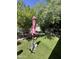 Spacious backyard features lush greenery, creating a serene outdoor retreat and ample space for gardening at 14402 N Saguaro Blvd # A, Fountain Hills, AZ 85268