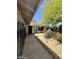 Charming front yard of this well-maintained home with mature landscaping and a cozy seating area at 14402 N Saguaro Blvd # A, Fountain Hills, AZ 85268