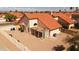 This home features a covered patio in the backyard, providing a relaxing outdoor space with desert landscaping for easy maintenance at 14418 S 42Nd St, Phoenix, AZ 85044