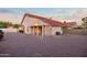 Private backyard with low maintenance desert landscaping and a covered patio, perfect for outdoor living at 14418 S 42Nd St, Phoenix, AZ 85044