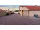 Expansive backyard with gravel landscaping and a partially covered patio area at 14418 S 42Nd St, Phoenix, AZ 85044