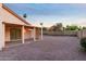 Large backyard featuring a covered patio area and low-maintenance gravel at 14418 S 42Nd St, Phoenix, AZ 85044