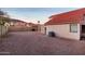 Gravel backyard with block wall, an AC unit, and covered patio at 14418 S 42Nd St, Phoenix, AZ 85044