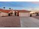 Single-Gathering home with a red tile roof, desert landscaping, and a spacious driveway leading to a garage at 14418 S 42Nd St, Phoenix, AZ 85044