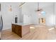 Bright living space showcasing wood floors, high ceilings and oversized windows bringing in natural light at 14418 S 42Nd St, Phoenix, AZ 85044