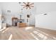 A modern living area featuring bright lighting, wood flooring, and vaulted ceilings perfect for entertaining at 14418 S 42Nd St, Phoenix, AZ 85044