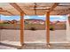 Covered patio view showcasing the low-maintenance backyard and mountain views beyond at 14418 S 42Nd St, Phoenix, AZ 85044