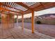Cozy covered patio with tiled flooring and a lattice-covered pergola for shade at 14418 S 42Nd St, Phoenix, AZ 85044